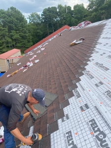 Our team putting on new roof on a house